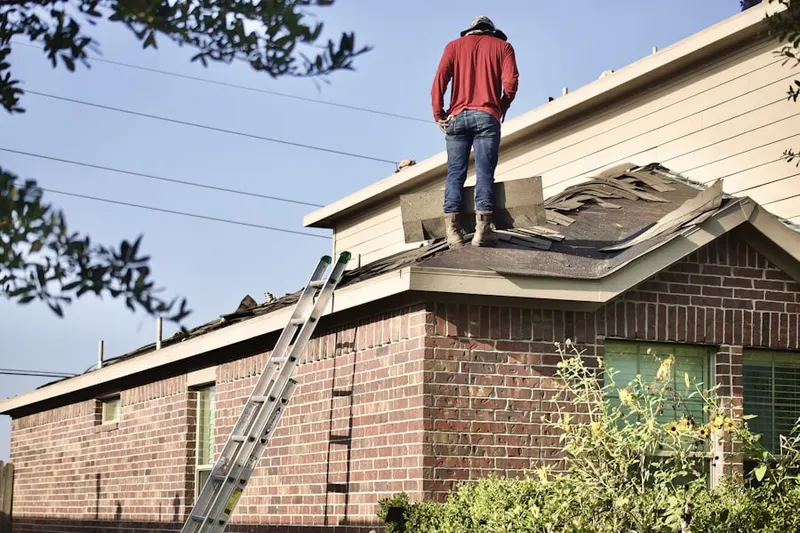 Professional roofer working on a residential roof in Shady Lane
